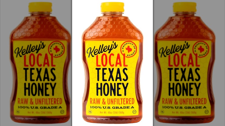 Bottle of Kelley's Local Texas Raw & Unfiltered Honey on a white background.