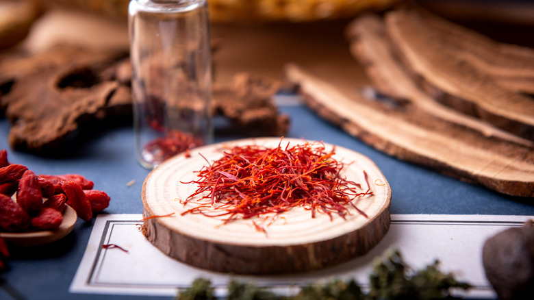 Saffron strands on wooden stand