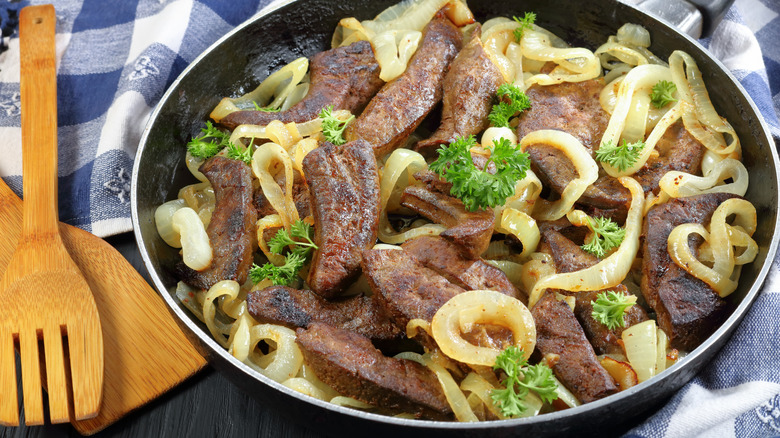 Liver and onions in a large bowl.