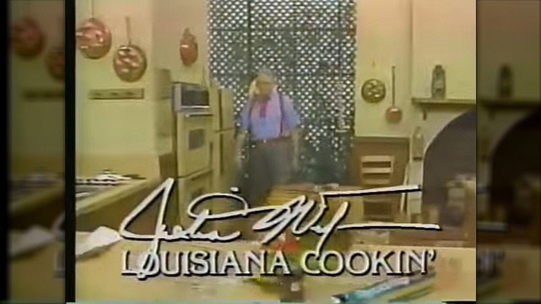 A "Louisiana Cookin'" title card with Justin Wilson's signature and Wilson, in a big red bow tie, entering the kitchen