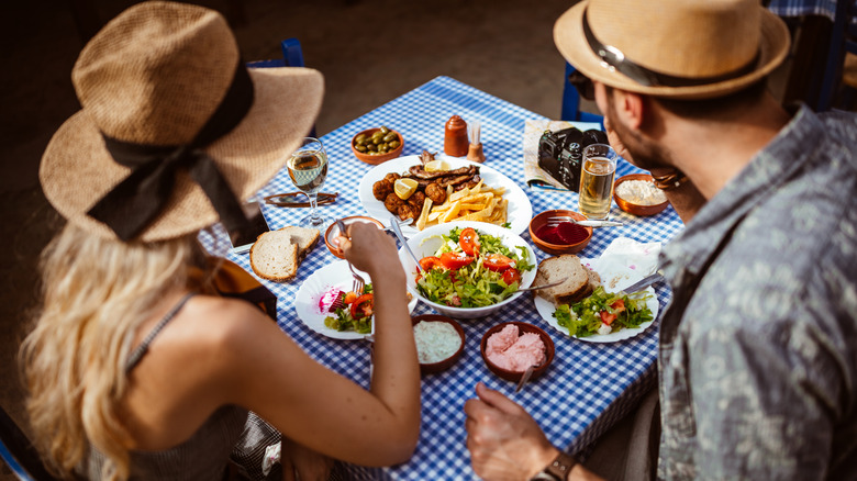 Couple eating Greek meal