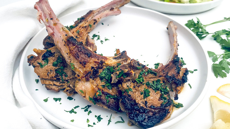 herby lamb chops on white plate