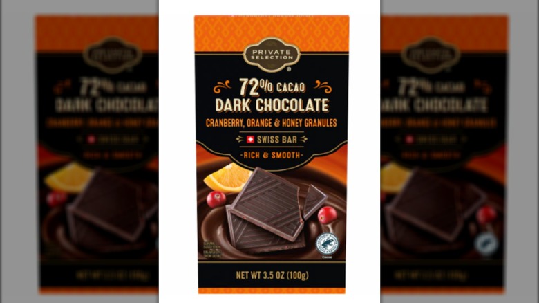 Black and orange packaging for Private selection dark chocolate bar with cranberry, orange, honey