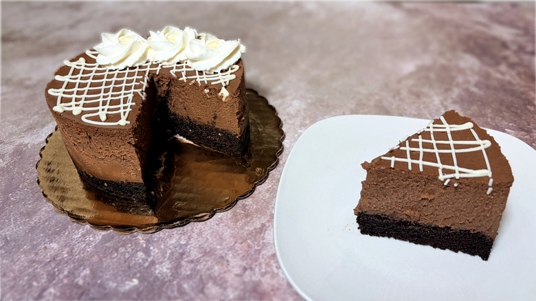 Chocolate cake, with one slice on a plate