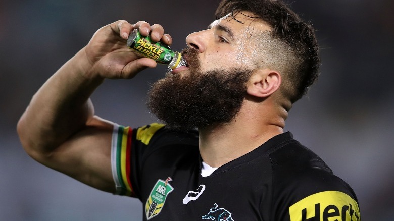 Athlete drinking pickle juice