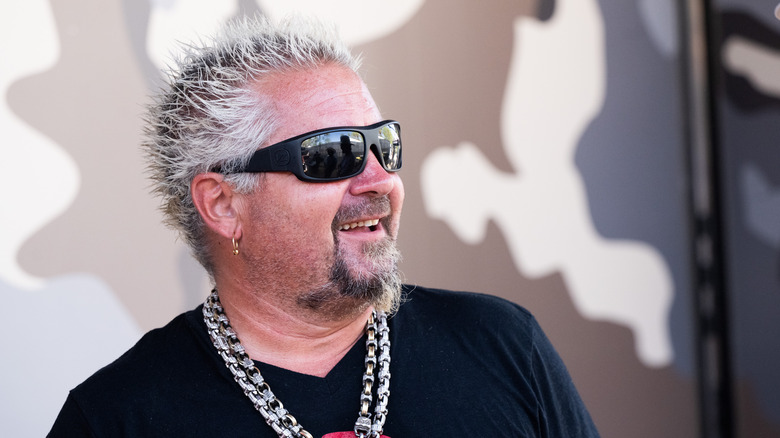 Guy Fieri with sunglasses and chains