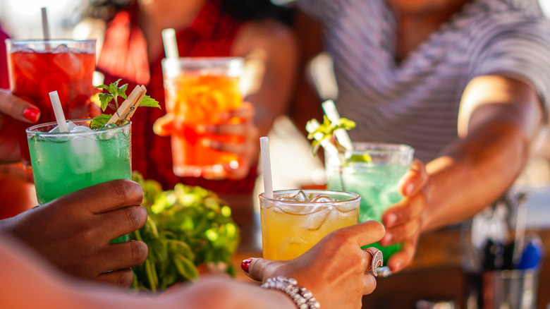 friends drinking different cocktails