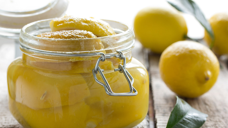 Preserved whole lemons in glass jar