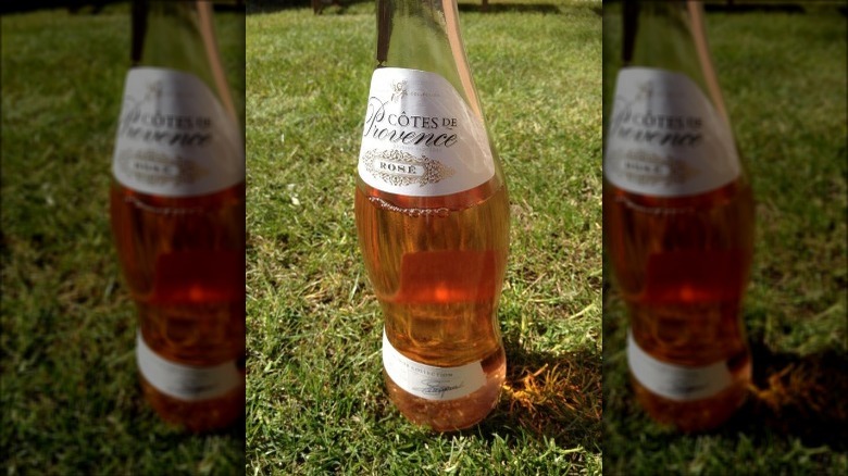 Bottle of rosé on lawn