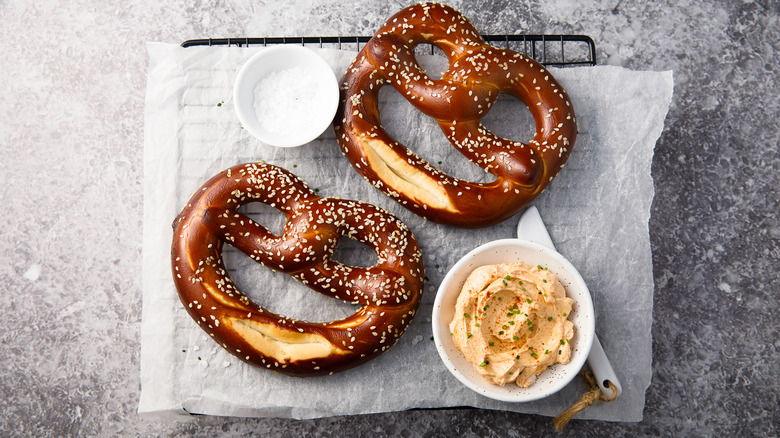 Two pretzels and dipping sauce