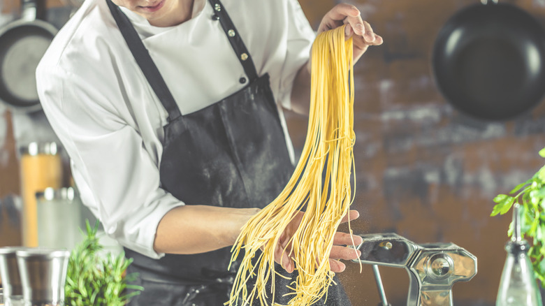 pasta chef making spaghetti