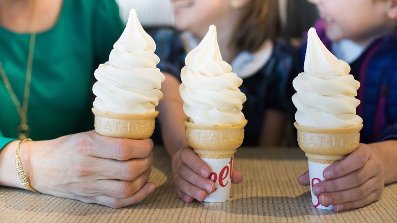 Adult and children with Chick-fil-A\ ice cream cones