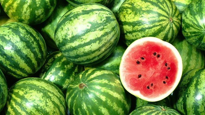 Split watermelon on whole melons