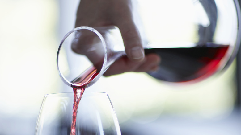 wine poured from decanter into glass