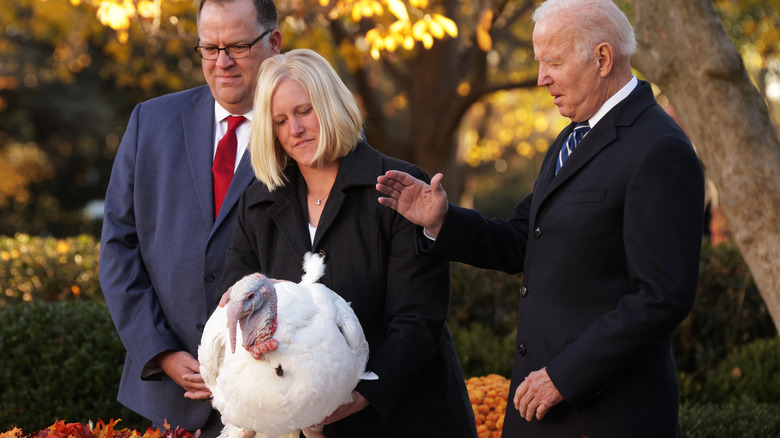 President Biden pardoning a turkey