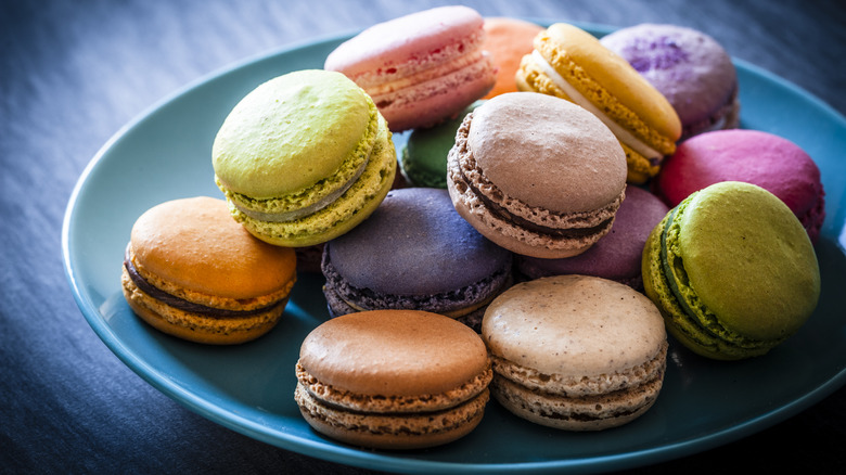 Pile of multicolored macarons plate