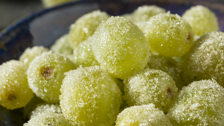 A group of frozen green grapes