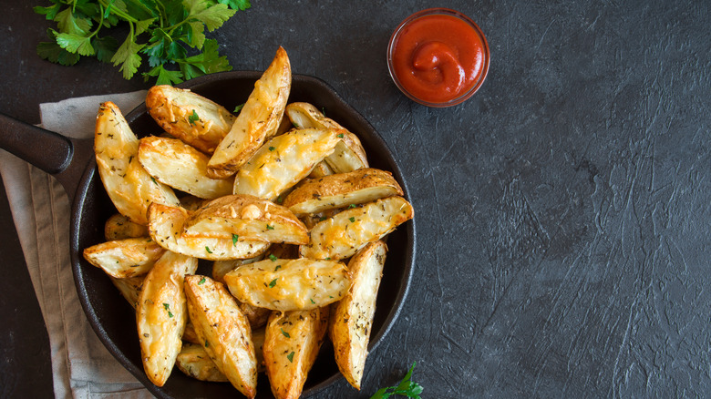 Potato wedges in pan