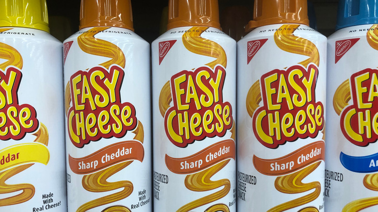 cans of sprayable easy cheese