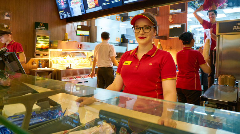 McDonald's staff member behind counter