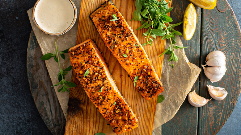 Salmon fillets on a plank