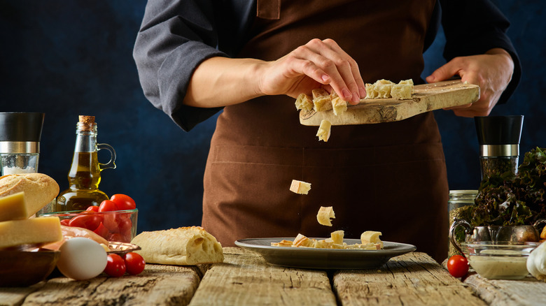 Cook preparing croutons