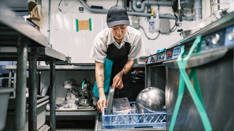 Restaurant Dishwasher working in the kitchen