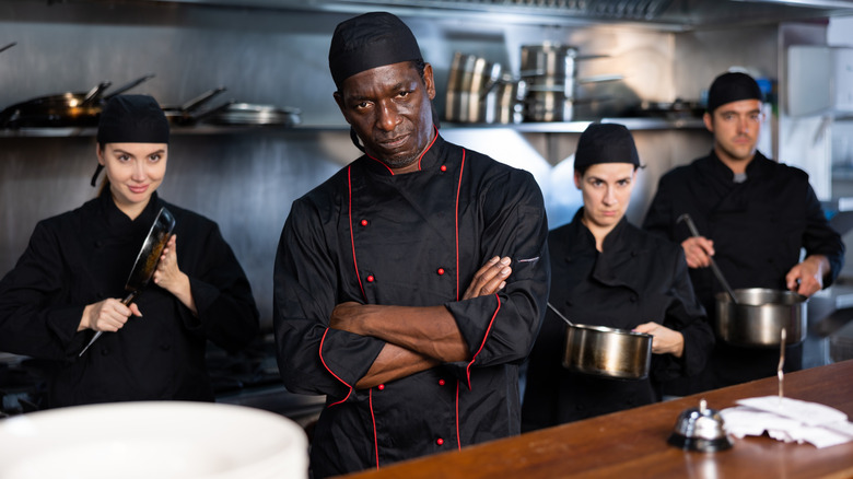 Executive Chef standing with his team