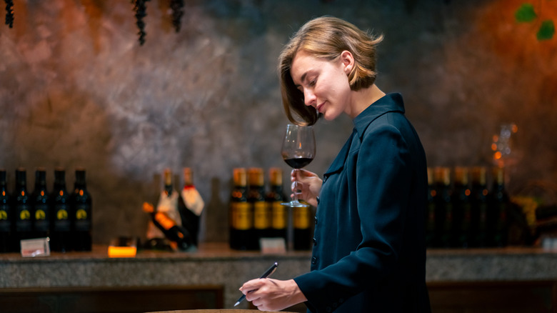 Female Sommelier tasting wines