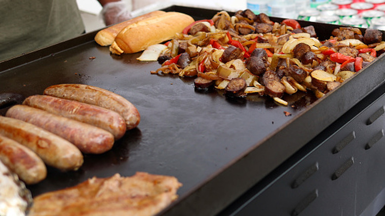 Group of friends grilling in a backyard