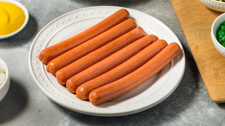 hot dogs on white plate