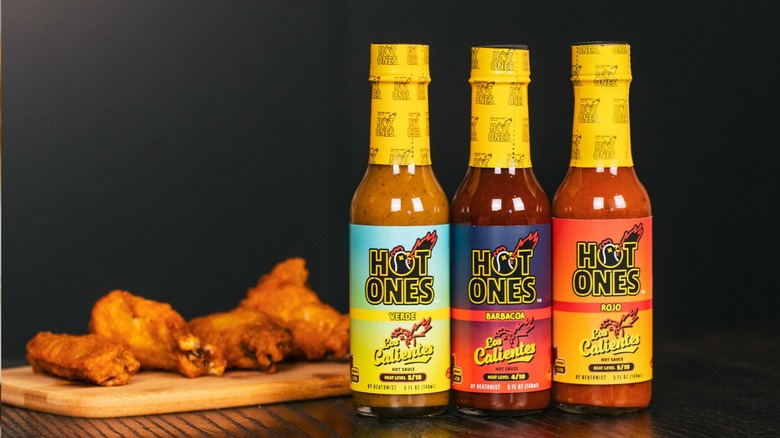 Hot Ones bottled sauces and chicken wings