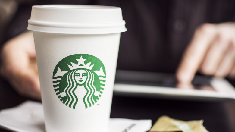 A Starbucks cup on a counter top