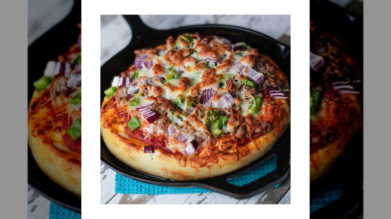 Deep dish pizza in cast iron skillet