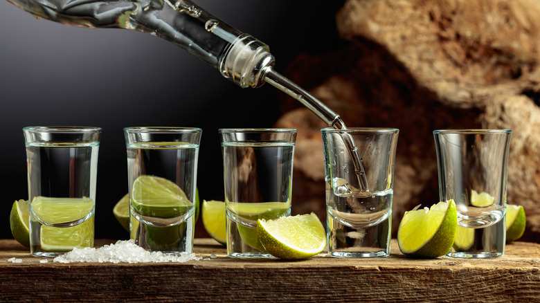 shots of tequila blanco, limes