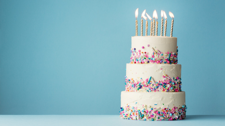 three tiered frosted cake