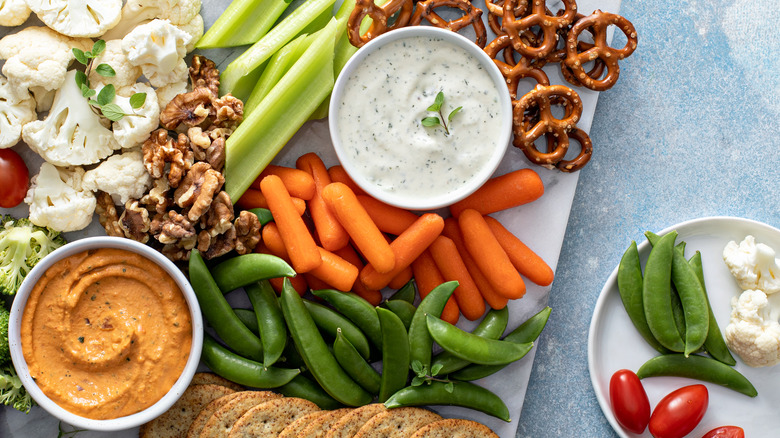 Charcuterie board with carrots and dip
