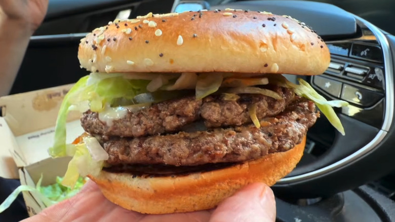 mcdonald's kiosk with big arch ad inside restaurant