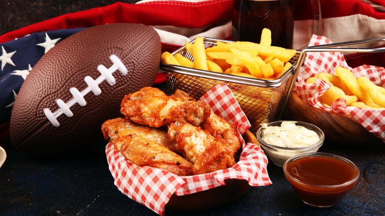 Snacks put out beside a football and American flag