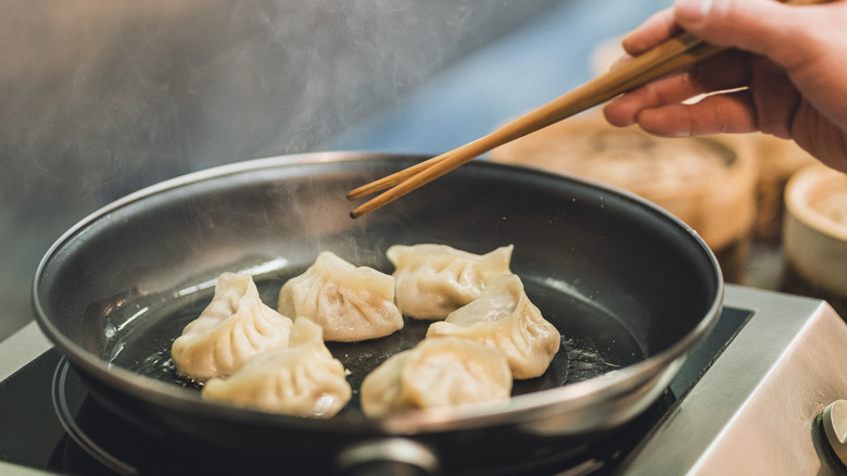 cooking dumplings in pan