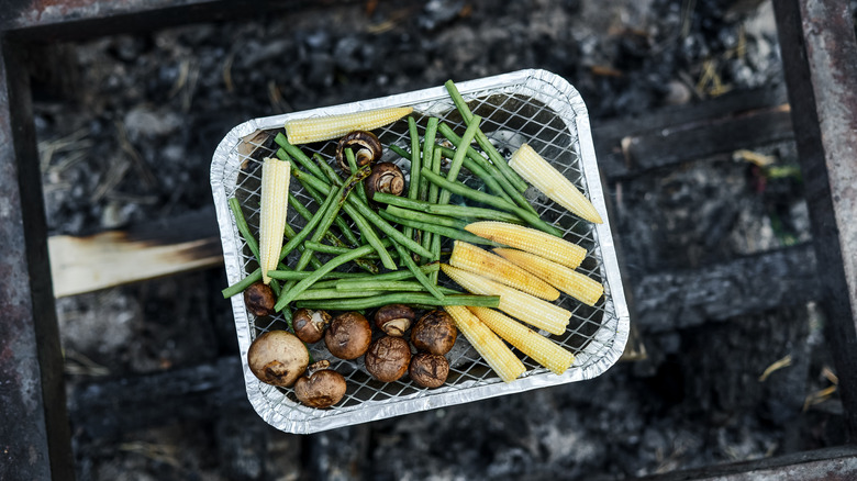 Assorted vegetables on disposable grill