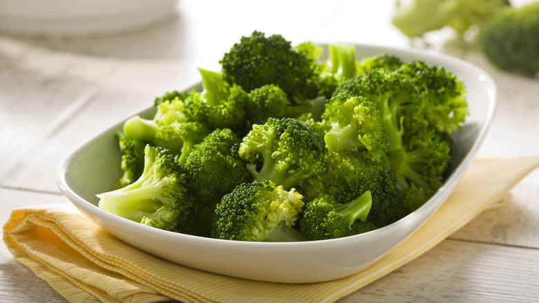 Steamed broccoli in white bowl