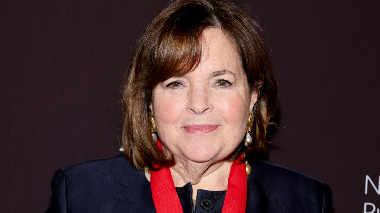 Ina Garten with red ribbon around her neck