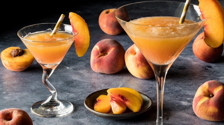 two bellini glasses with peaches