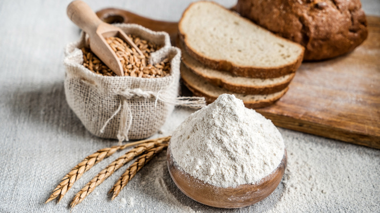 Sack of flour and bread on table