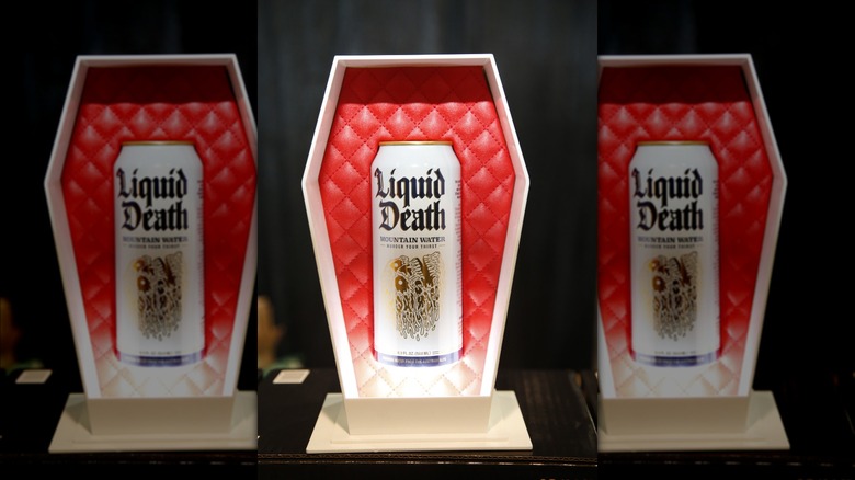 Liquid Death displayed in coffin