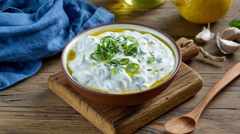 bowl of sour cream with herbs