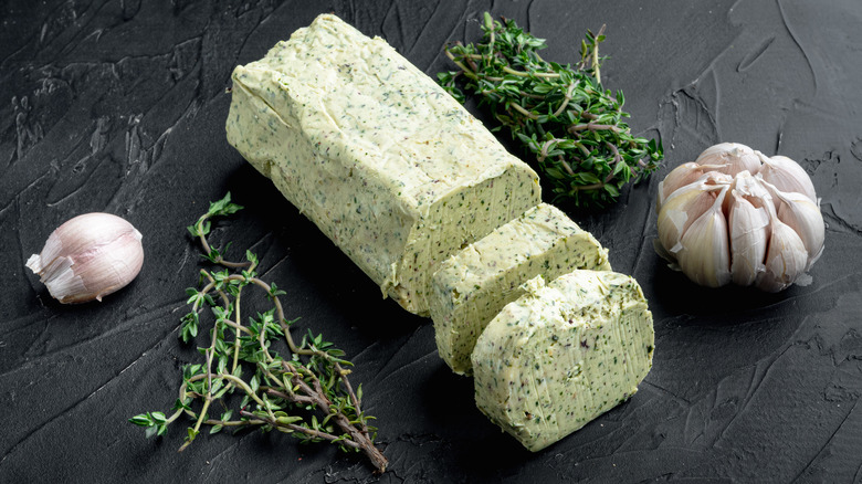 butter with herbs on slab