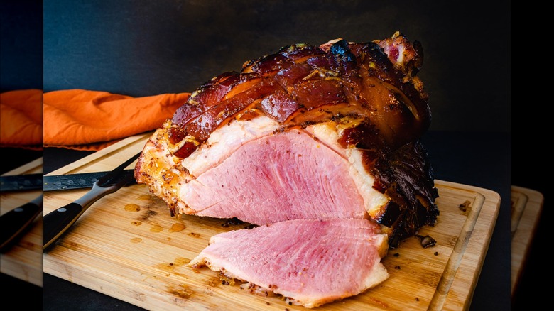 sliced ham on cutting board