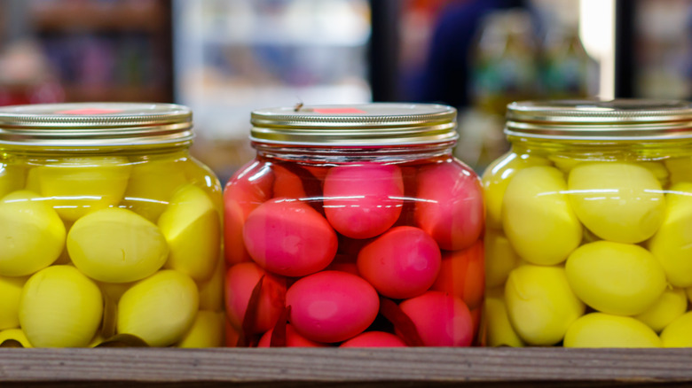 jars of colorful pickled eggs